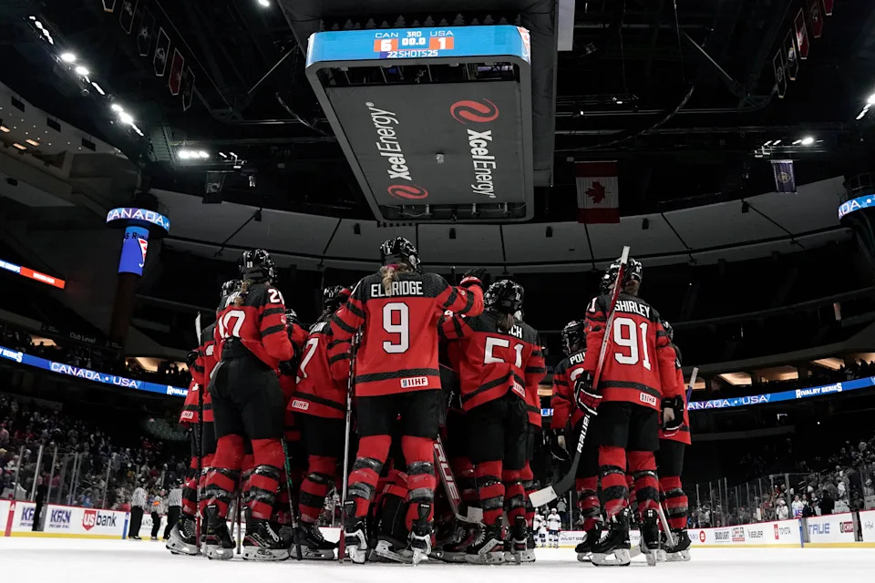 Feb 11, 2024; Saint Paul, Minnesota, USA; Team Canada celebrates their victory against Team USA after a Rivalry Series women's ice hockey game at Xcel Energy Center. Mandatory Credit: Nick Wosika-USA TODAY Sports