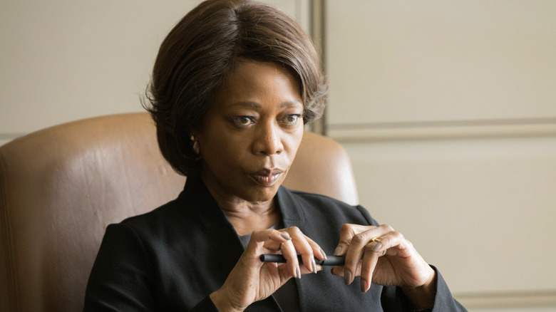 Alfre Woodard as Bernadine Williams holding a pen in Clemency