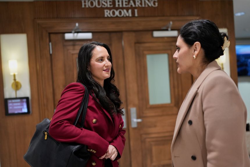 Molecular toxicologist Alexandra Muñoz, left, speaks with Rep. Gabby Salinas outside a hearing room at the Tennessee State Capitol in Nashville on January 21.