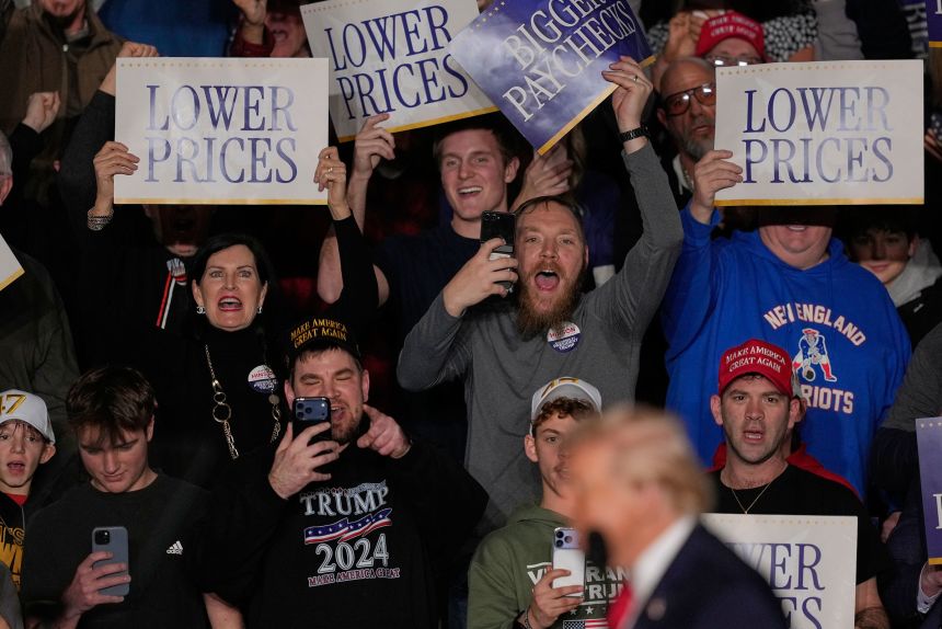 People cheer as President Donald Trump arrives to speak about the economy at a rally in Clive, Iowa, on January 27, 2026.