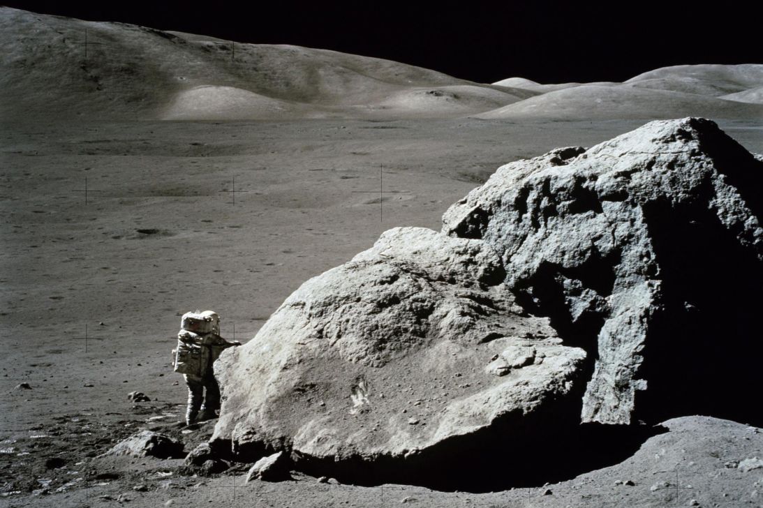 NASA astronaut and geologist Harrison H. Schmitt stands beside a huge lunar boulder during the Apollo 17 mission in December 1972.