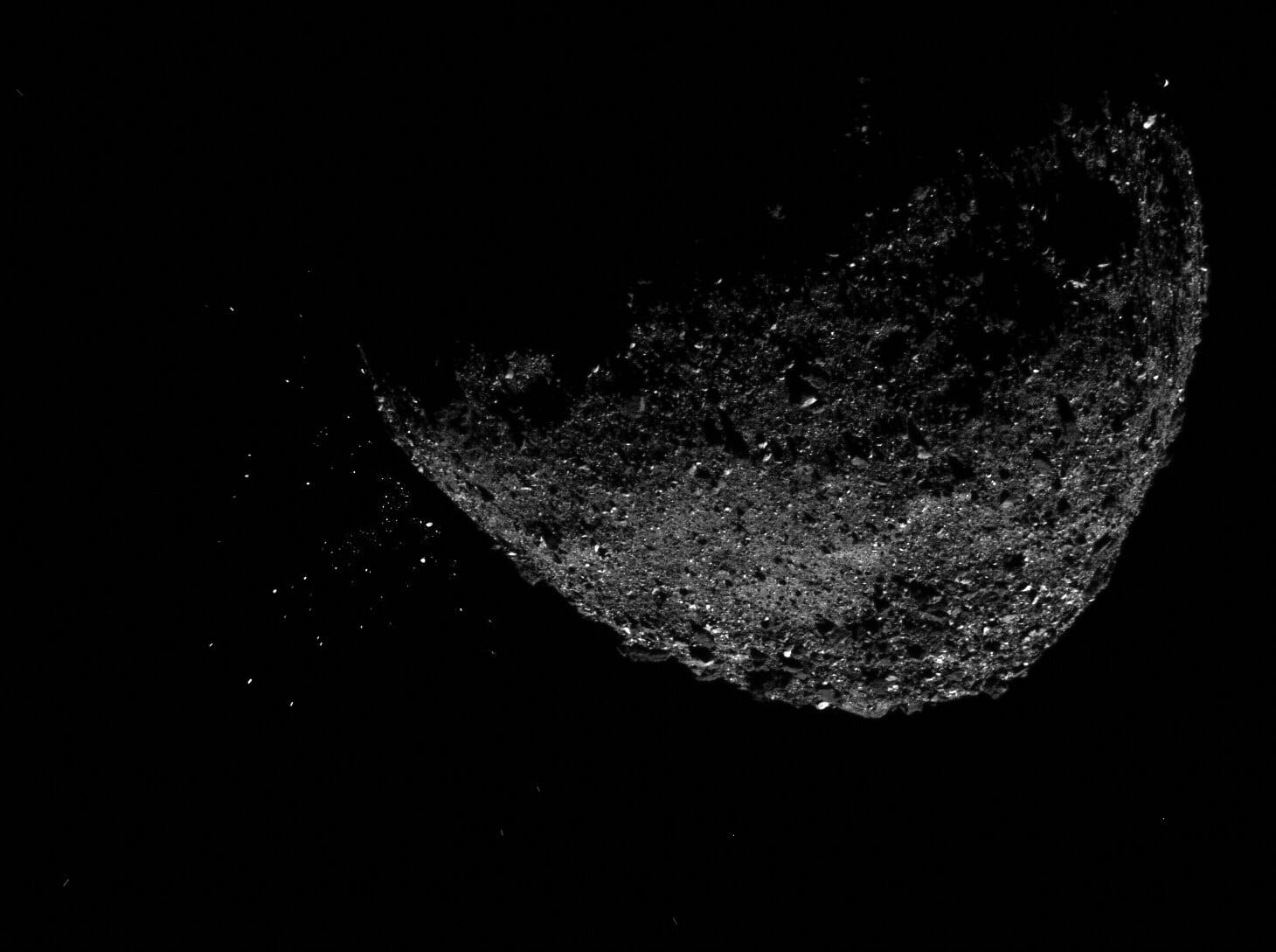 Asteroid Bennu ejecting particles.