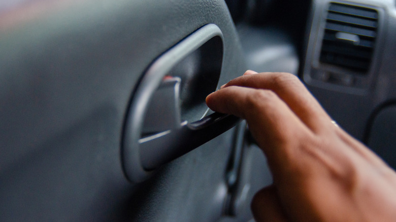 Pulling a car handle to open the door