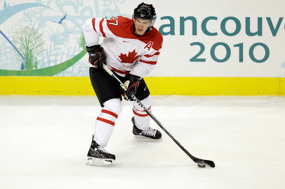 Feb 18, 2010; Vancouver, BC, CANADA;  Sidney Crosby (87) (CAN) looks to pass the puck against Switzerland during the preliminary round of group A game 8 play in the 2010 Vancouver Winter Olympics at Canada Hockey Place. Mandatory Credit: John David Mercer-USA TODAY Sports