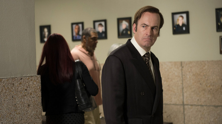 Saul Goodman (Bob Odenkirk) stands grimacing in a hallway in Better Call Saul