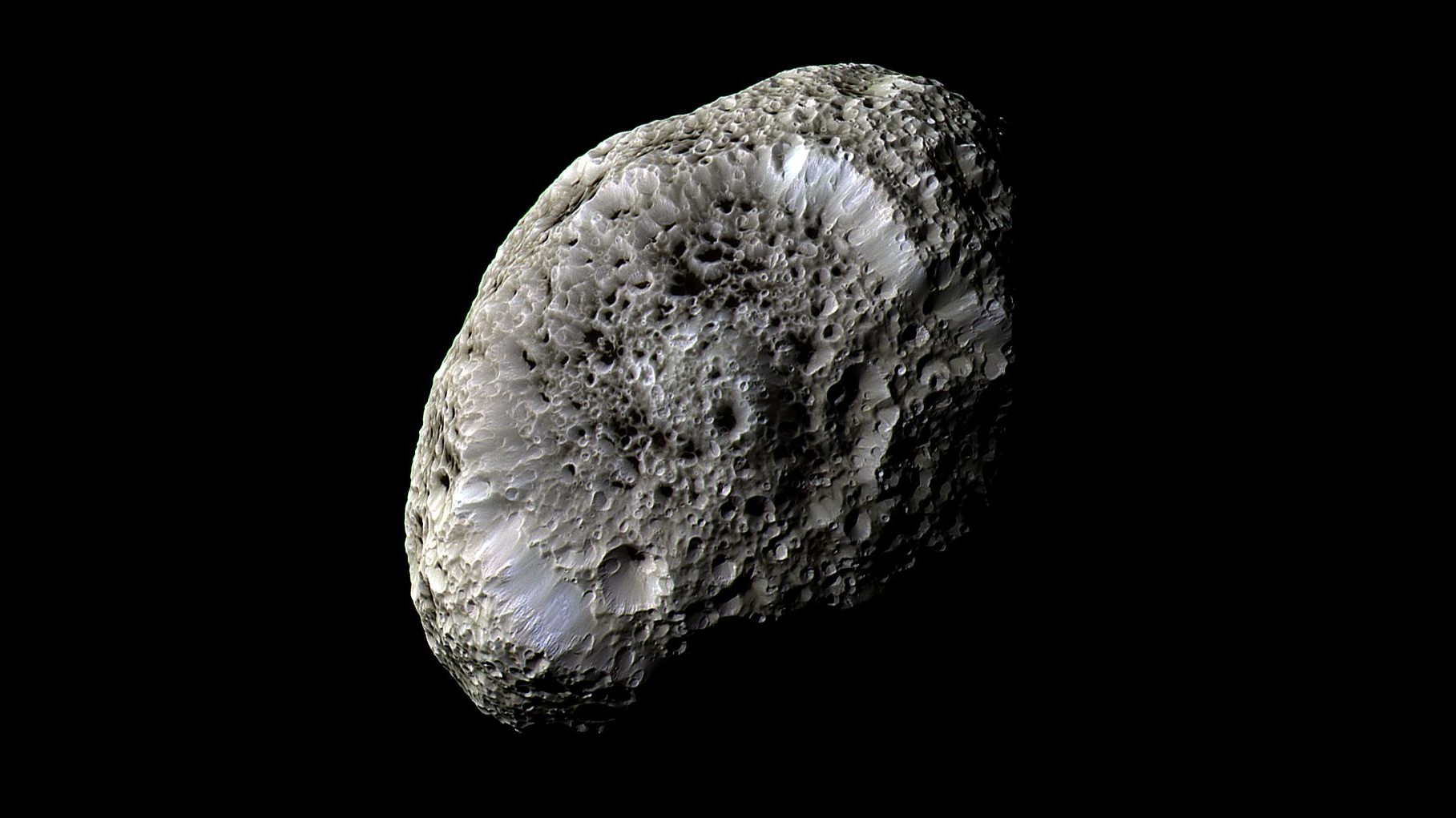 A sponge-looking rock in space.