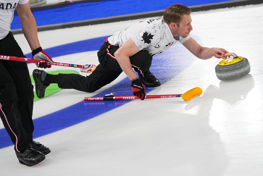 Marc Kennedy competes in a men's curling semifinal match at the 2026 Winter Olympics.