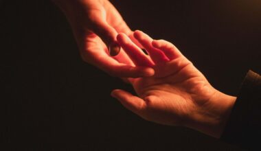 One hand reaching for another