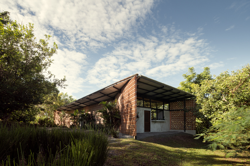 a series of porous brick partitions enclose central garden within costa rica residence