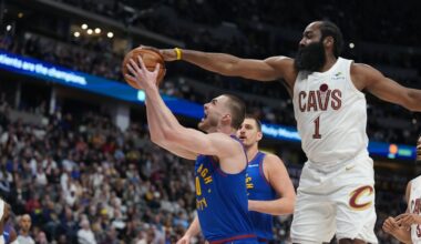 Cleveland Cavaliers guard James Harden, right, goes up to block a shot by Denver Nuggets guard Christian Braun in the first half of an NBA basketball game Monday, Feb. 9, 2026, in Denver. (AP Photo/David Zalubowski)
