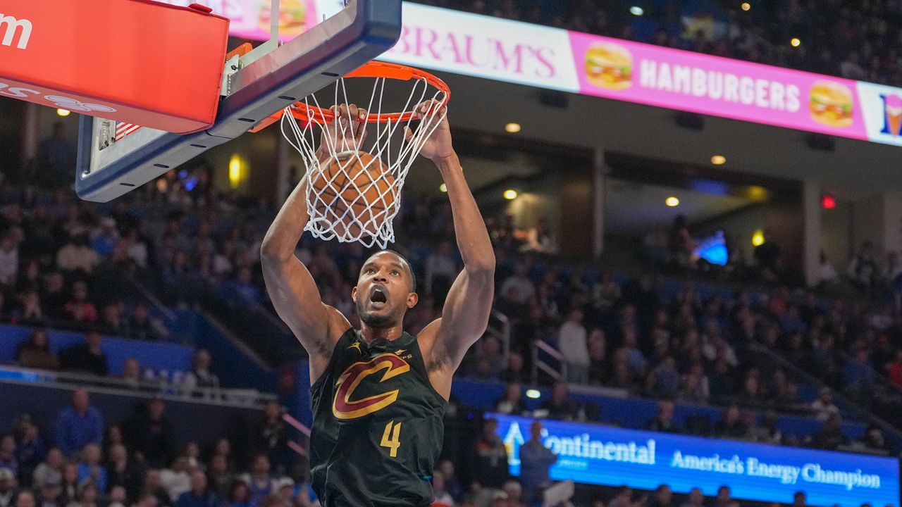 Cleveland Cavaliers center Evan Mobley dunks during the second half of an NBA basketball game against the Oklahoma City Thunder, Sunday, Feb. 22, 2026, in Oklahoma City. (AP Photo/Kyle Phillips)