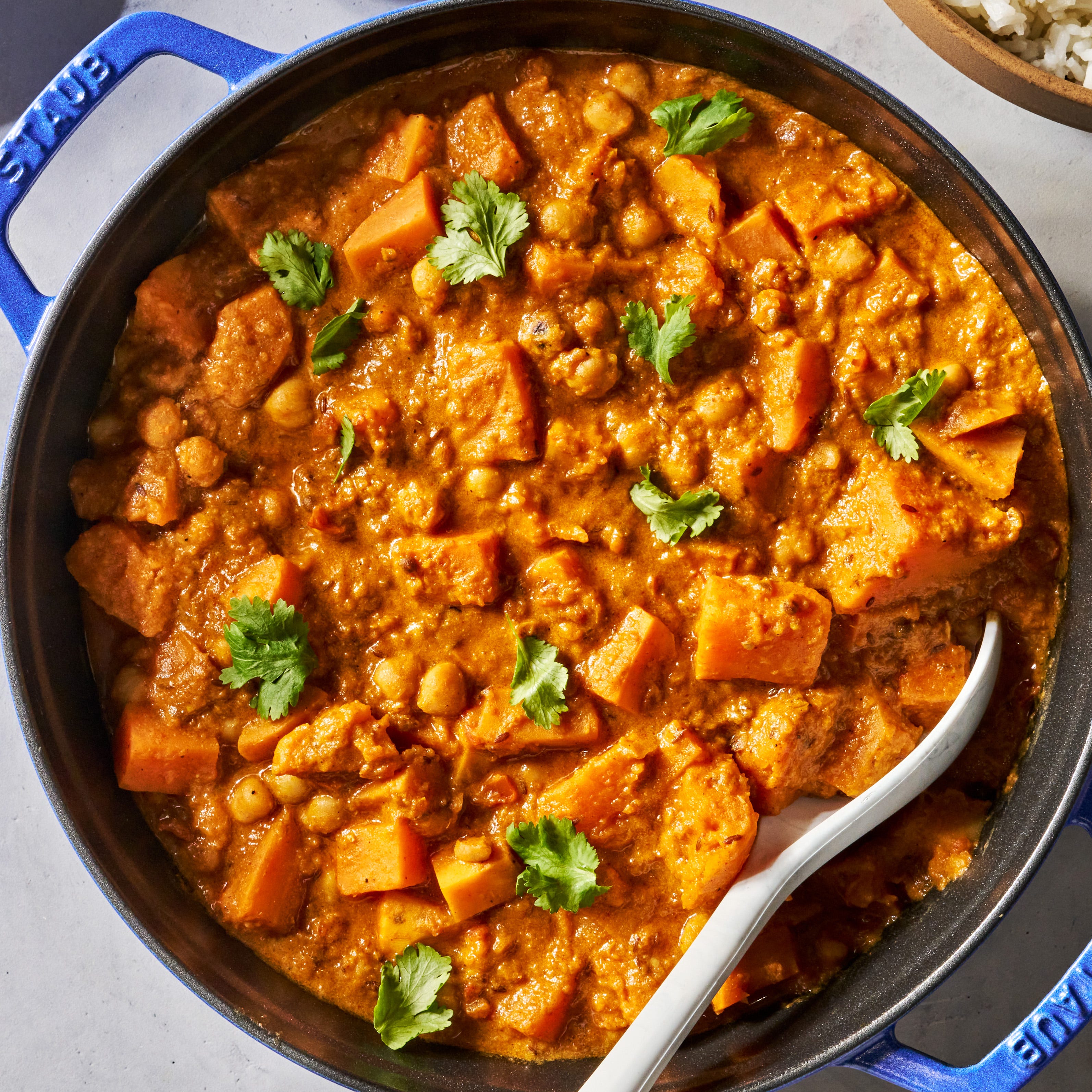 creamy coconut chickpea and sweet potato curry in a skillet