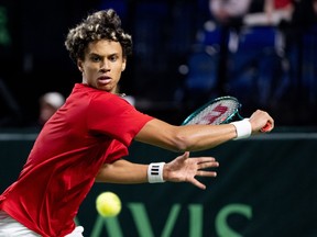 An action shot of a tennis player mid-match