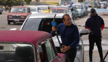 A driver refuels as others wait in a long line behind to fill up at a gas station in Havana, Cuba, Tuesday, Jan. 27, 2026.