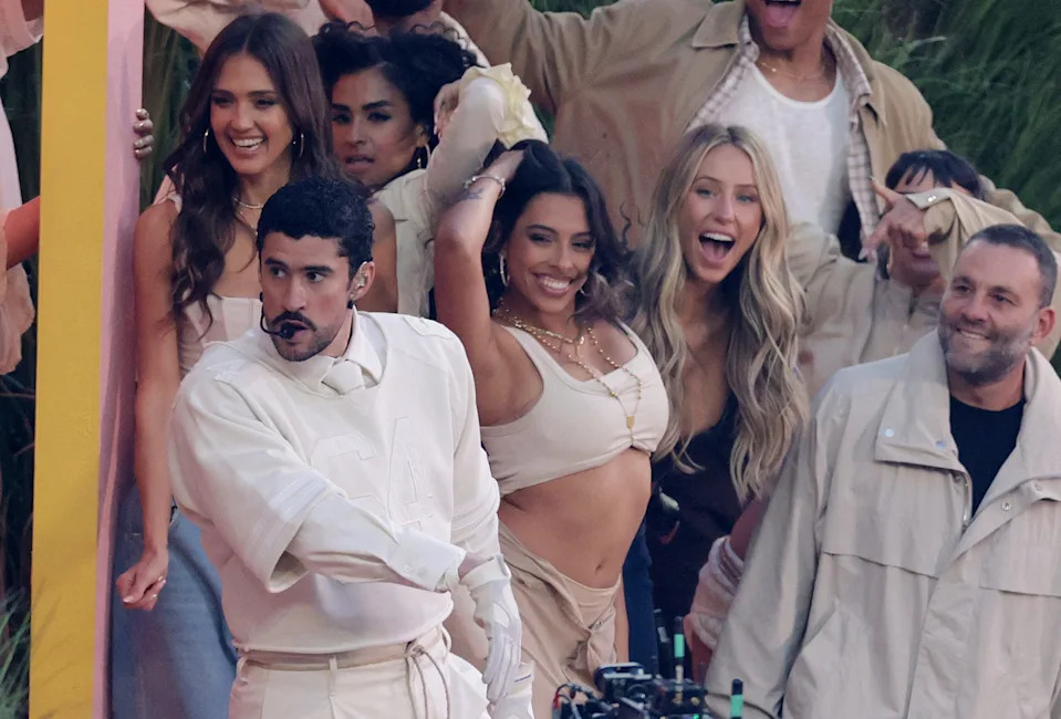 Bad Bunny performs alongside Jessica Alba, Alix Earle and David Grutman during the halftime show.