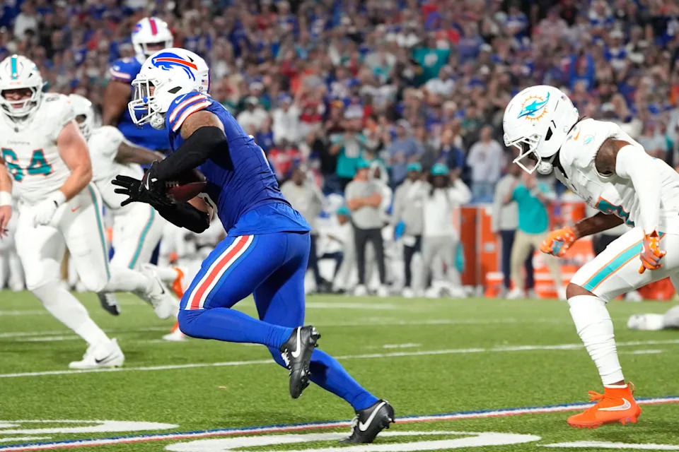 Sep 18, 2025; Orchard Park, New York, USA; Buffalo Bills linebacker Terrel Bernard (8) runs against Miami Dolphins wide receiver Jaylen Waddle (17) in the fourth quarter at Highmark Stadium. Mandatory Credit: Gregory Fisher-Imagn Images
