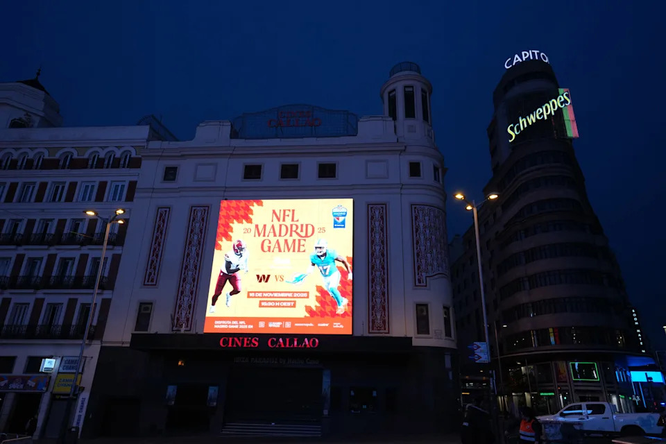 <p>Nov 16, 2025; Madrid, Spain; An advertisement for the 2025 NFL Madrid Game between the Washington Commanders and the Miami Dolphins on the Cines Callao facade. Mandatory Credit: Kirby Lee-Imagn Images</p>