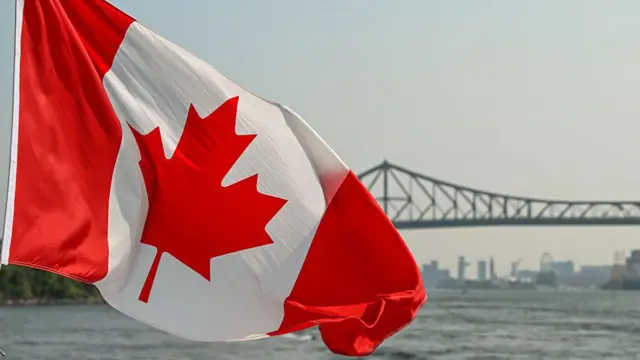 Canada flag wit bridge for di background