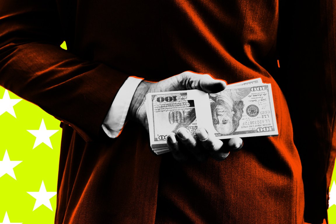A person in a dark suit with a white shirt cuff is holding a stack of $100 bills behind their back. The background is bright yellow with white stars. The image has a high-contrast, stylized effect with orange highlights on the suit.