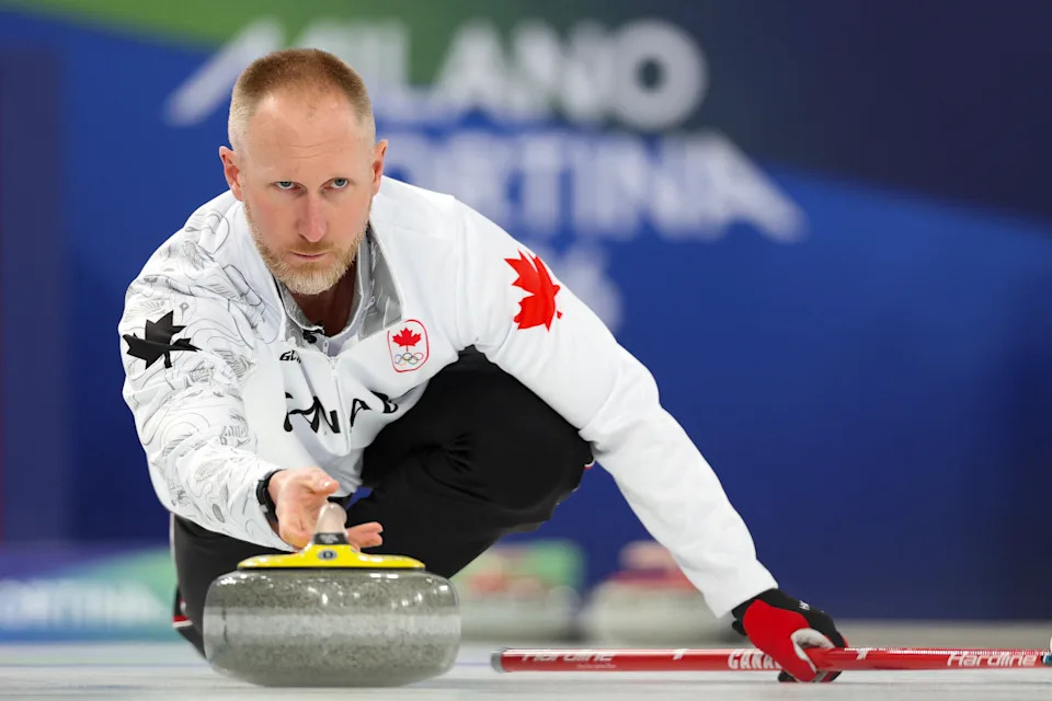 Canada's Brad Jacobs delivers the stone in the curling men's round robin between Norway and Canada during the Milano Cortina 2026 Winter Olympic Games at the Cortina Curling Olympic Stadium in Cortina d'Ampezzo on February 19, 2026. (Photo by Odd ANDERSEN / AFP via Getty Images)