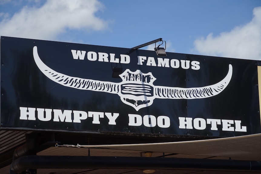 A close-up shot of the Humpty Doo Hotel sign. The black sign in white writing says: 'World famous Humpty Doo Hotel'.