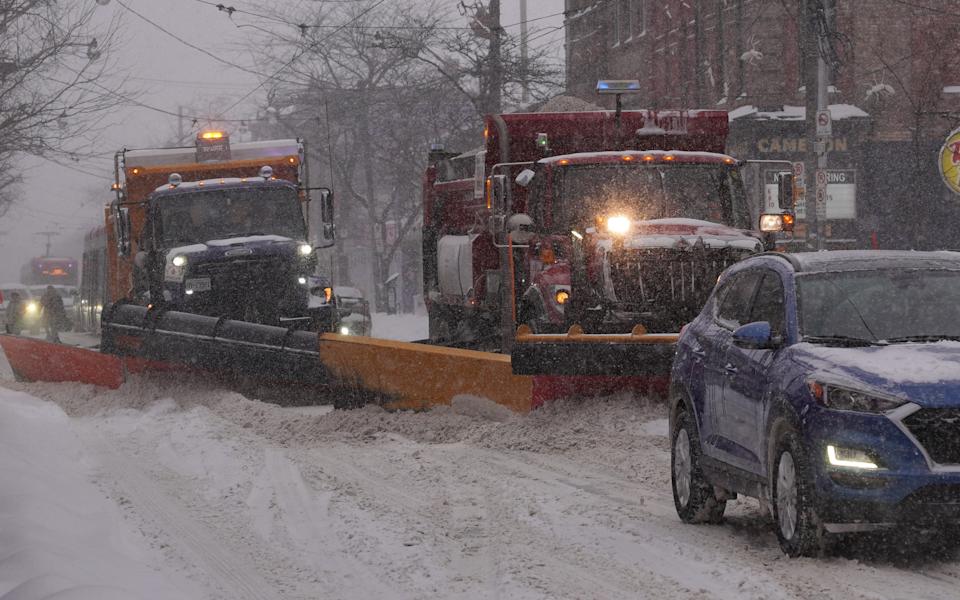A snowplow makes its way along the road during a snowstorm in Toronto, Ontario, Canada, on January 25, 2026. A massive winter storm sweeps across Toronto and the Greater Toronto and Hamilton Area (GTHA) on Sunday, dumping up to 60 centimeters of snow. (Photo by Arrush Chopra/NurPhoto via Getty Images)