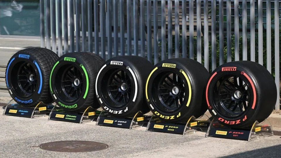 F1 tyres on display from left to right; blue full wet tyres, green intermediate tyres, white hard tyres, yellow medium tyres and red soft tyres