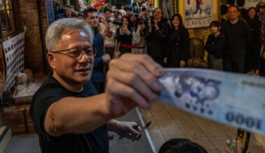 Jensen Huang feeding money off-screen.