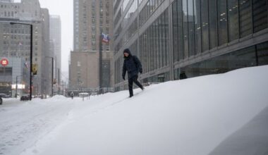 A pedestrian navigates a snowed-in staircase amid heavy snowfall and accumulation as snow and heavy winds continue to hammer the Greater Toronto Area, in Toronto, Thursday, Jan. 15, 2026. THE CANADIAN PRESS/Giordano Ciampini