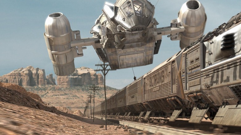 The Serenity flies over a train on a desolate western planet on Firefly (2002-2003)