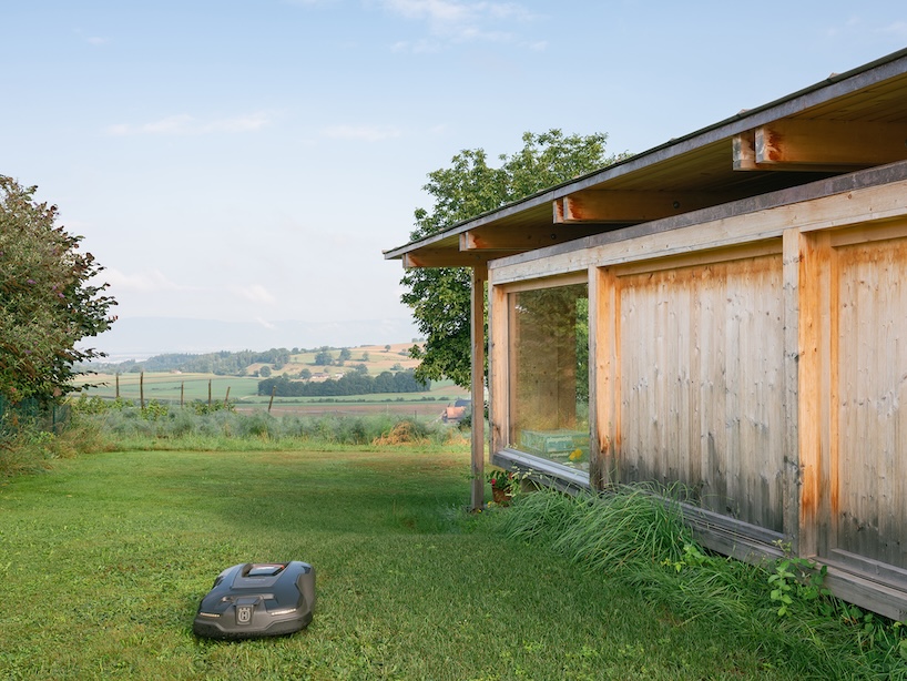 timber garden folly pavilion transitions between resting shelter and planted patio