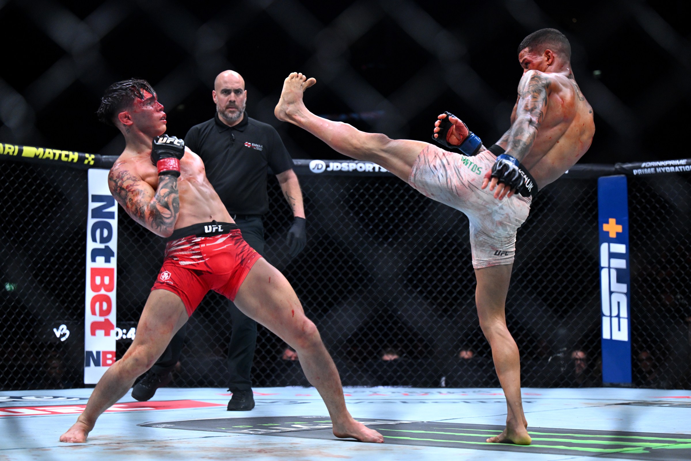 LONDON, ENGLAND - MARCH 22: Lone’er Kavanagh reacts to a kick from Felipe dos Santos during the Flyweight fight between Lone’er Kavanagh and Felipe dos Santos at The O2 Arena on March 22, 2025 in London, England. (Photo by Justin Setterfield/Getty Images)