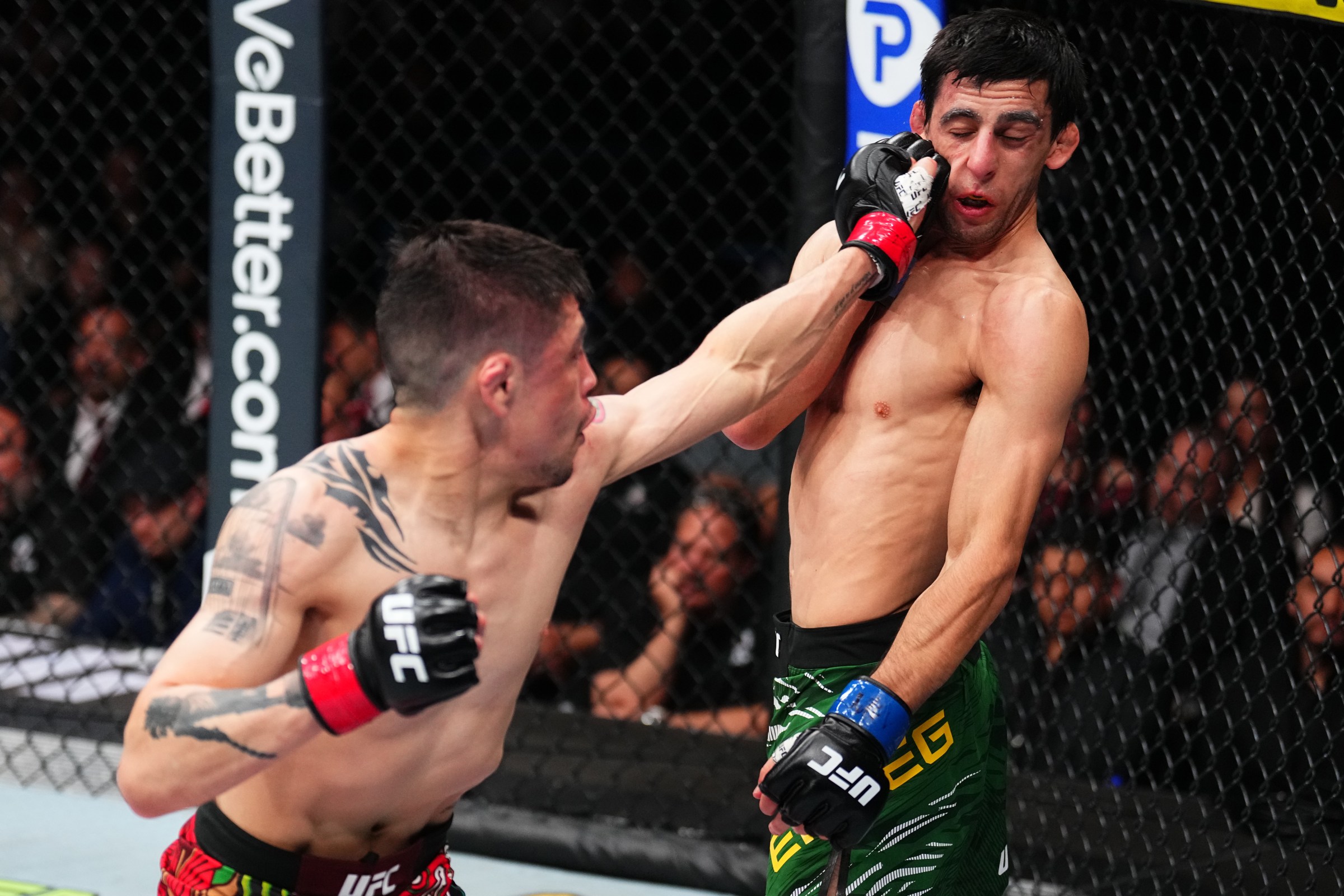 MEXICO CITY, MEXICO - MARCH 29: (L-R) Brandon Moreno of Mexico punches Steve Erceg of Australia in a flyweight fight during the UFC Fight Night event at CDMX Arena on March 29, 2025 in Mexico City, Mexico. (Photo by Chris Unger/Zuffa LLC)