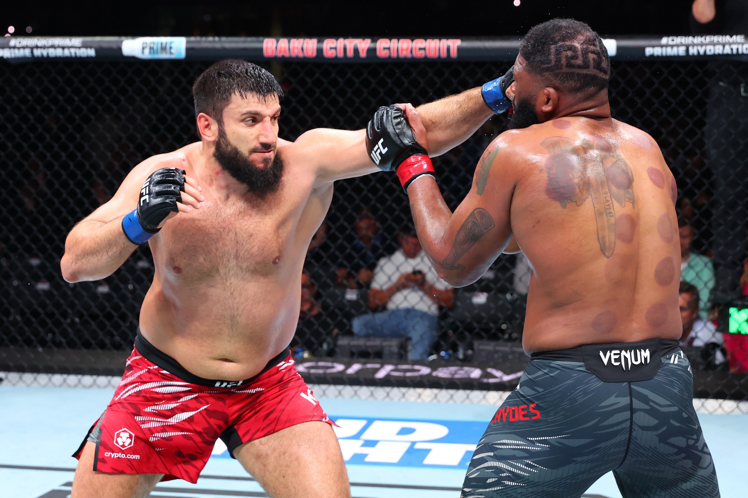 BAKU, AZERBAIJAN - JUNE 21: (L-R) Rizvan Kuniev of Russia punches Curtis Blaydes in their heavyweight fight during the UFC Fight Night event at Baku Crystal Hall on June 21, 2025 in Baku, Azerbaijan. (Photo by Ed Mulholland/Zuffa LLC)