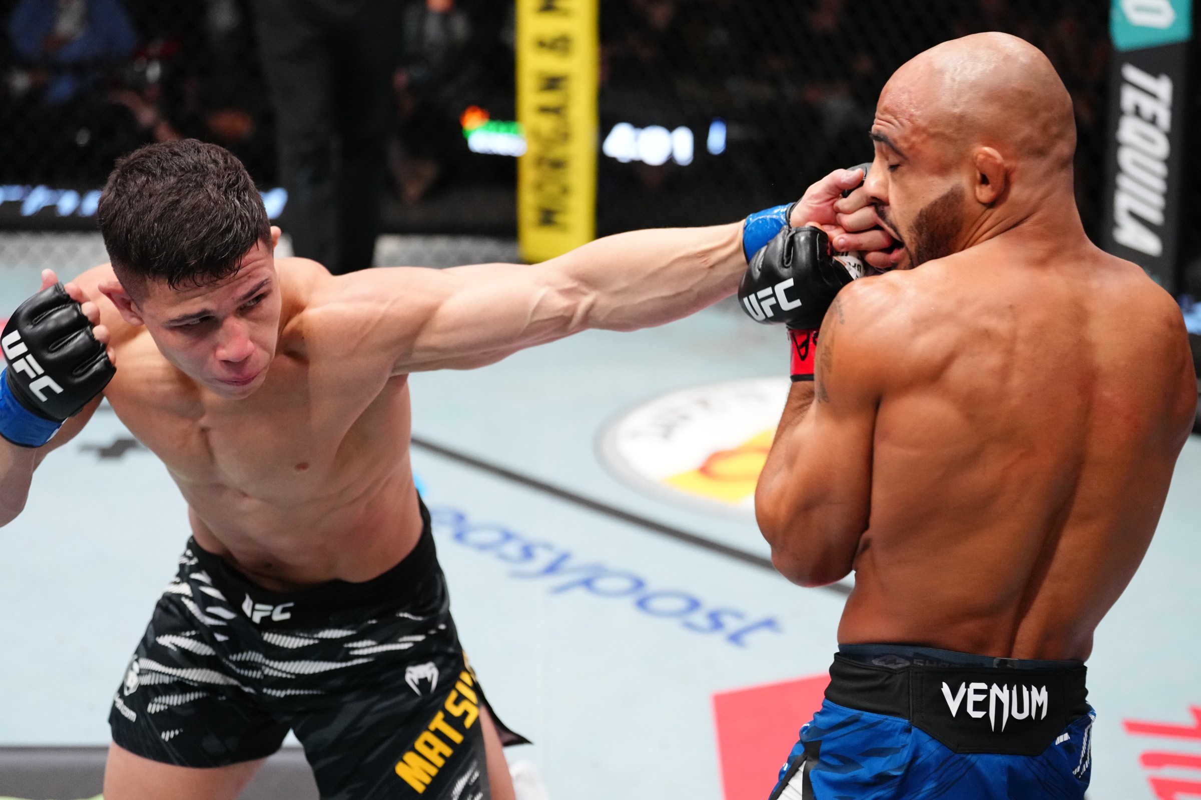 LAS VEGAS, NEVADA - AUGUST 09: (L-R) Jean Matsumoto of Brazil punches Miles Johns in a bantamweight fight during the UFC Fight Night event at UFC APEX on August 09, 2025 in Las Vegas, Nevada. (Photo by Jeff Bottari/Zuffa LLC)