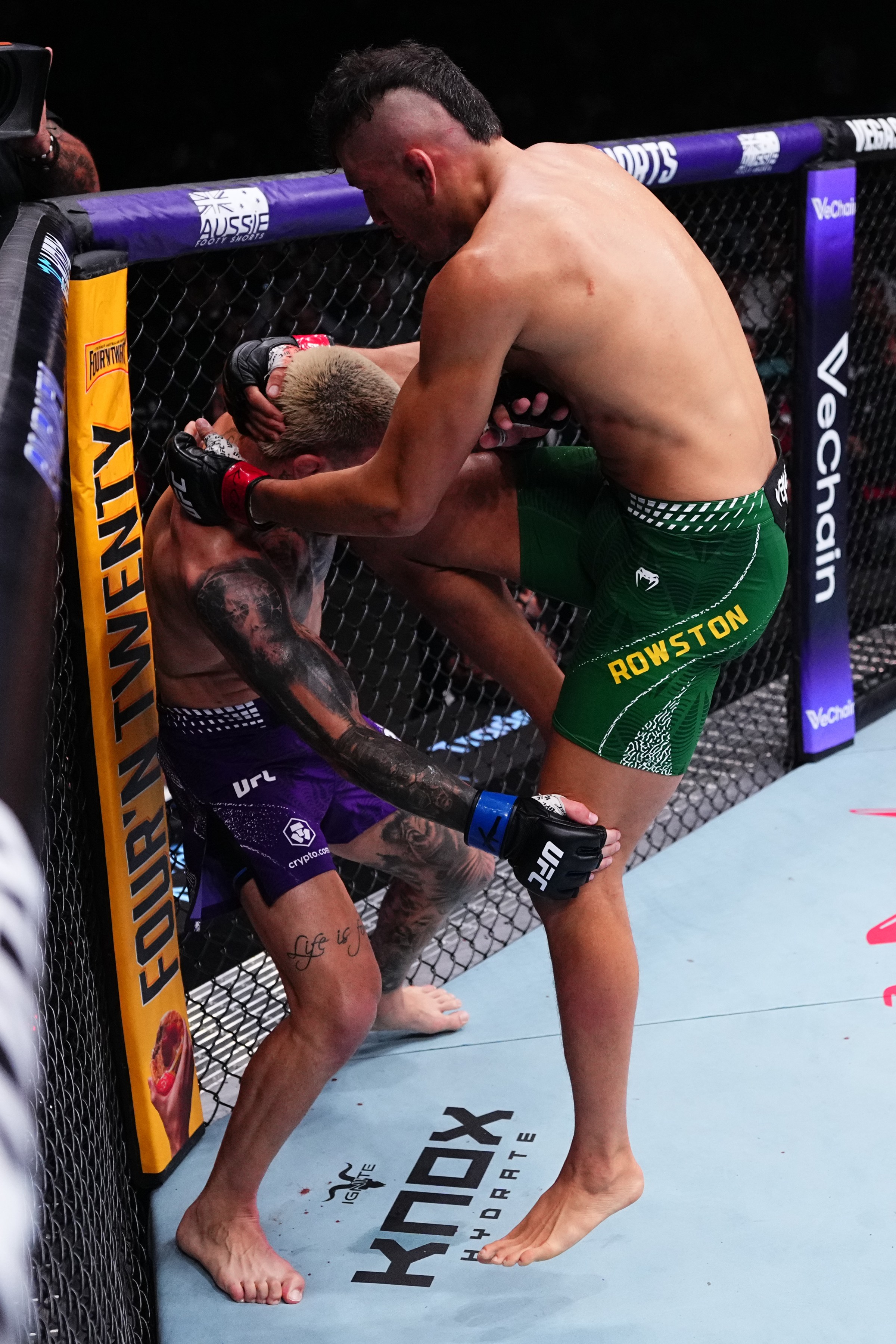 SYDNEY, AUSTRALIA - FEBRUARY 01: (R-L) Cam Rowston of Australia knees Cody Brundage in a middleweight fight during the UFC 325 event at Qudos Bank Arena on February 01, 2026 in Sydney, Australia. (Photo by Jeff Bottari/Zuffa LLC)