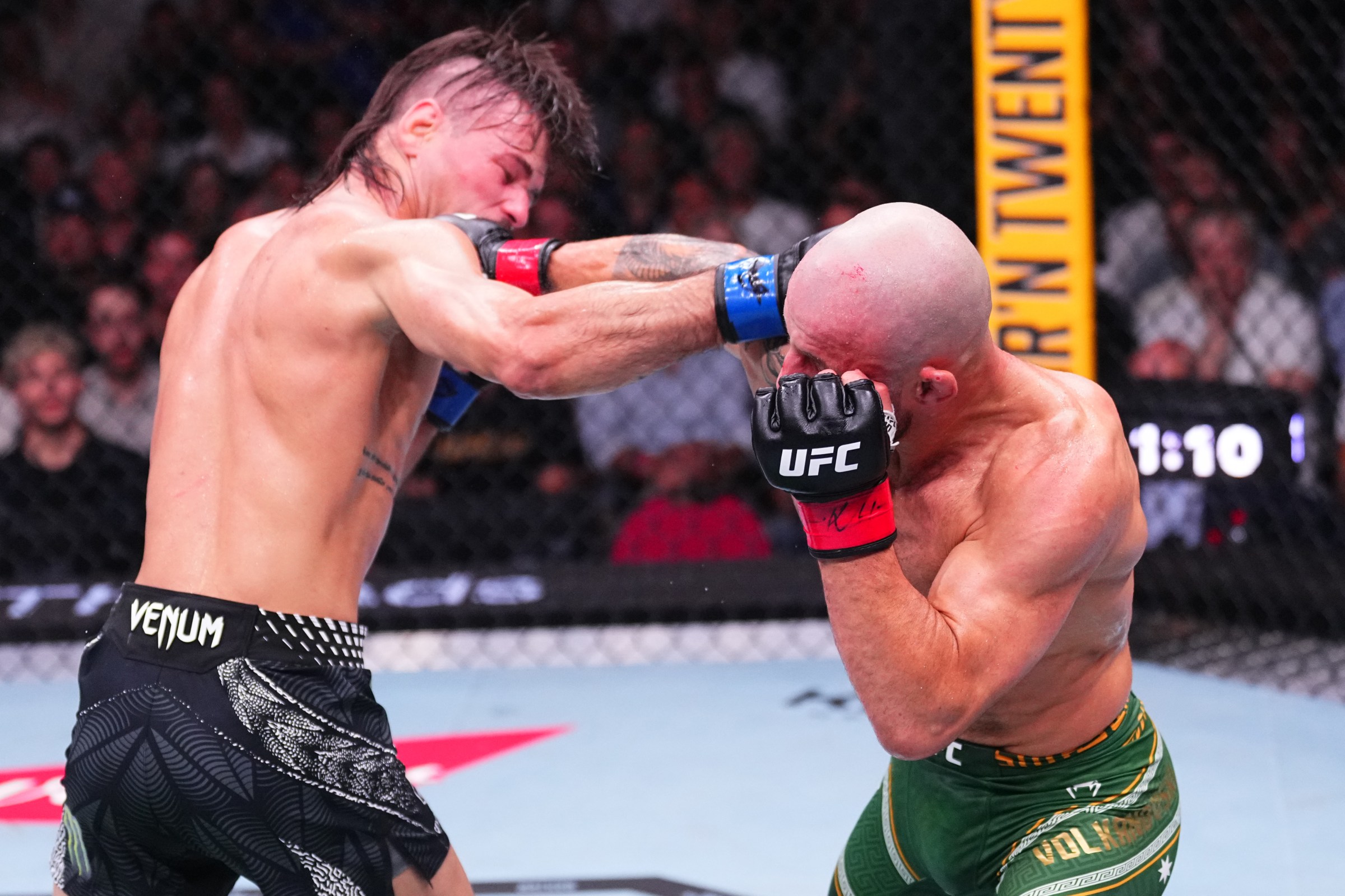 SYDNEY, AUSTRALIA - FEBRUARY 01: (R-L) Alexander Volkanovski of Australia punches Diego Lopes of Brazil in the UFC featherweight championship fight during the UFC 325 event at Qudos Bank Arena on February 01, 2026 in Sydney, Australia. (Photo by Jeff Bottari/Zuffa LLC)