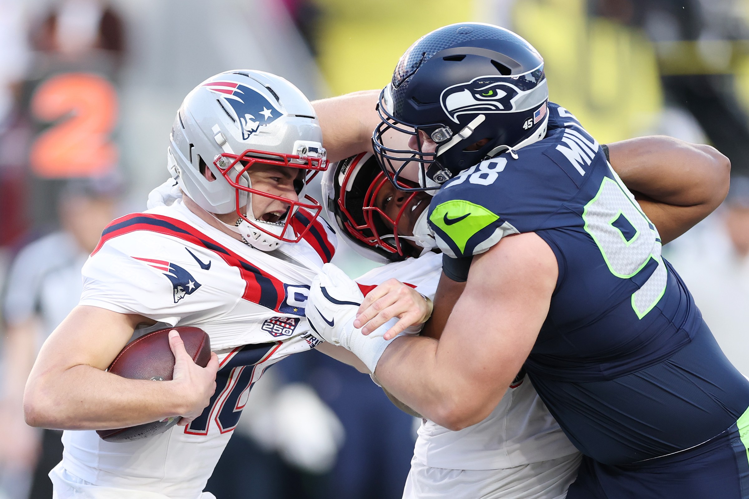 SANTA CLARA, CALIFORNIA - FEBRUARY 08: Drake Maye #10 of the New England Patriots is sacked by Rylie Mills #98 of the Seattle Seahawks during the second quarter in Super Bowl LX at Levi’s Stadium on February 08, 2026 in Santa Clara, California. (Photo by Kevin C. Cox/Getty Images)