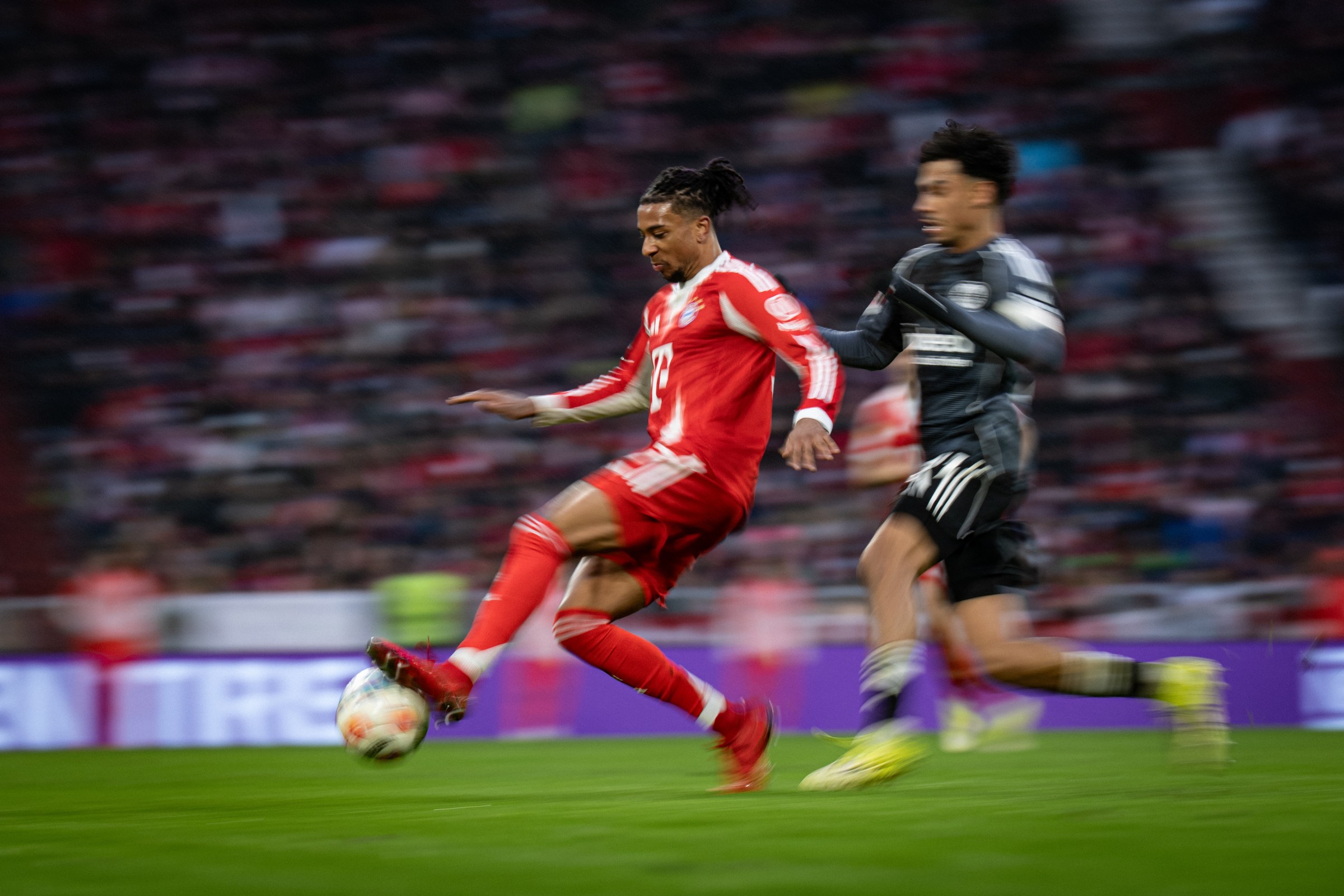 MUNICH, GERMANY - FEBRUARY 21: Michael Olise of FC Bayern Muenchen in duel during the Bundesliga match between FC Bayern München and Eintracht Frankfurt at Allianz Arena on February 21, 2026 in Munich, Germany. (Photo by F. Noever/FC Bayern via Getty Images)