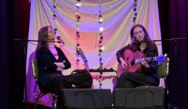 Haley Blais and Sam Lynch collect their laurels at the WISE Hall