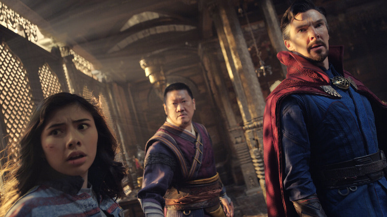 America Chavez, Wong, and Doctor Strange looking concerned in 