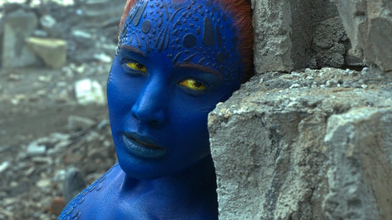 Jennifer Lawrence as Mystique leaning against some rubble in X-Men: Apocalypse