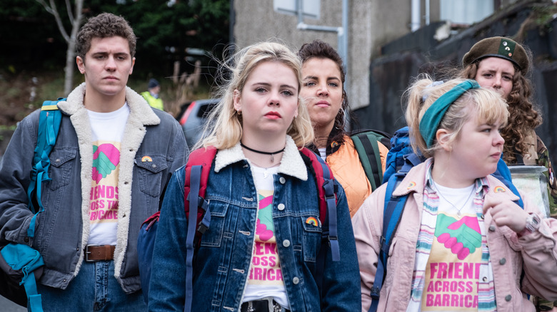 Dylan Llewellyn as James walking next to Jamie-Lee O'Donnell as Michelle, Louisa Harland as Orla, with Saoirse-Monica Jackson as Erin and Nicola Coughlan as Clare in the front in Derry Girls
