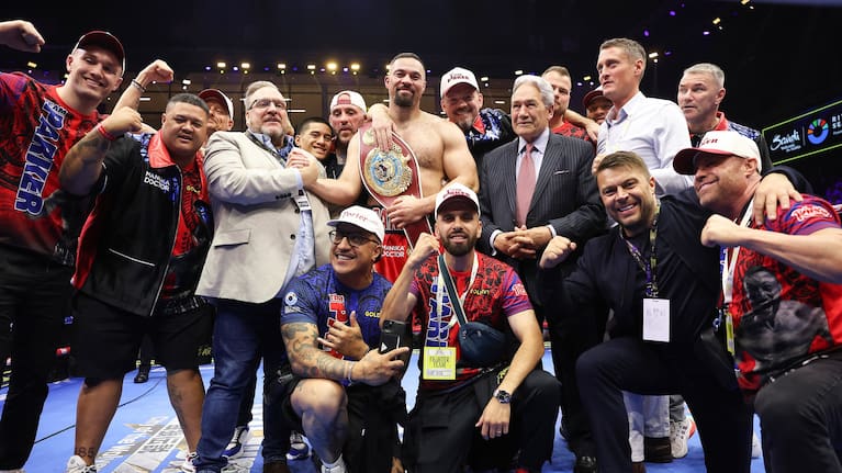 Joseph Parker celebrates in the ring with his team and supporters, including deputy Winston Peters, in Riyadh in 2025.
