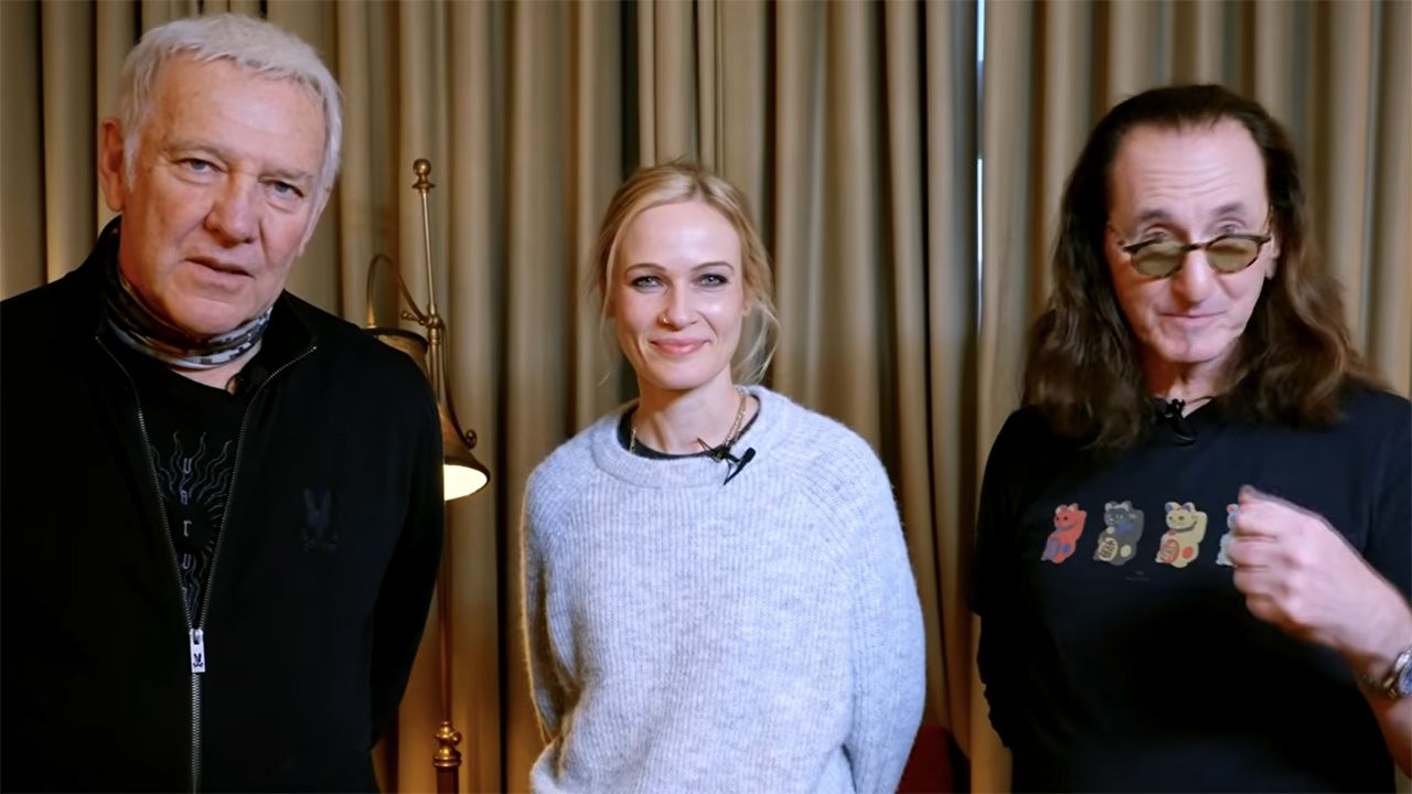 Alex Lifeson, Anika Nilles and Geddy Lee of Rush