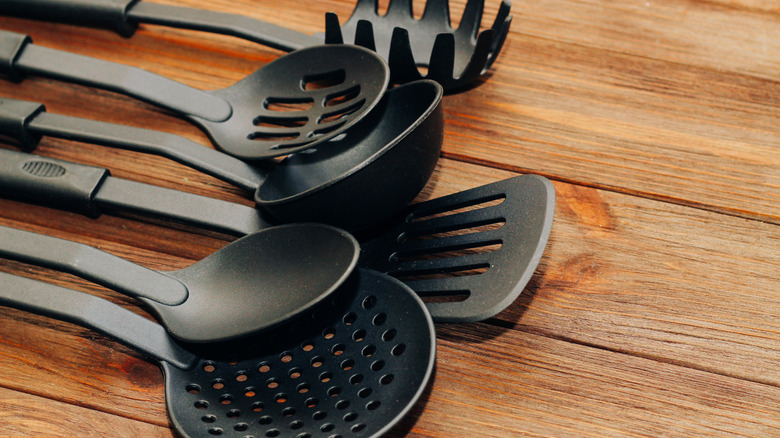 Plastic kitchen utensils on a countertop