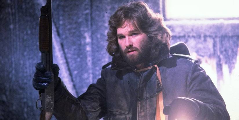 R.J. MacReady looking around with a lantern in The Thing.