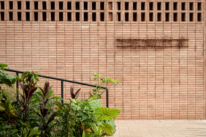 cast in red-pigmented concrete, la cacaotera museum celebrates cacao heritage in mexico - 3