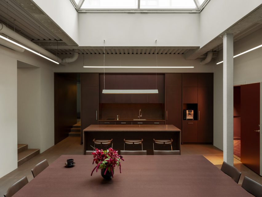 Kitchen with red accents within the showroom