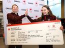 B.C. speed skating siblings Daniel and Laura Hall pose for pictures with their 'ticket' to the Milano Cortina 2026 Olympic Winter Games.
